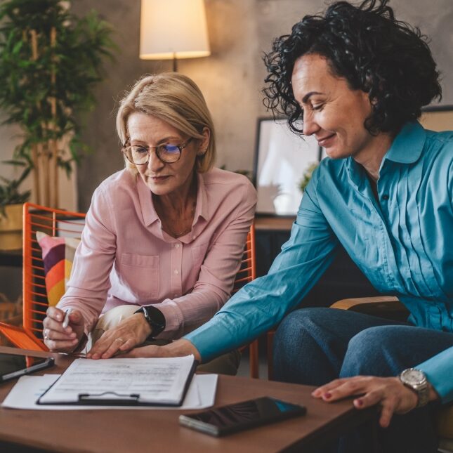 Two women reviewing the older woman's estate