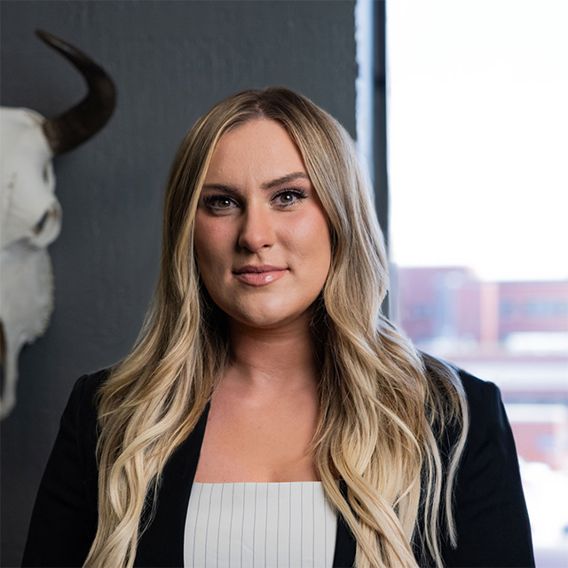 Headshot of Kelsey Prestesater in the Hathaway & Kunz office