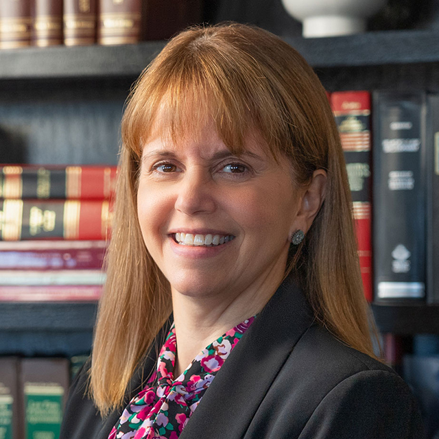 Headshot of Flavia Naves in the Hathaway & Kunz office