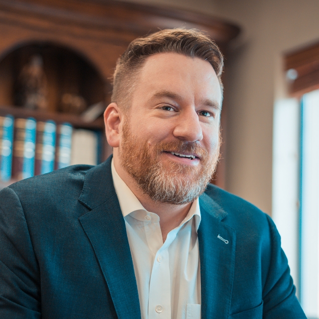 Lucas E. Buckley smiling in his office