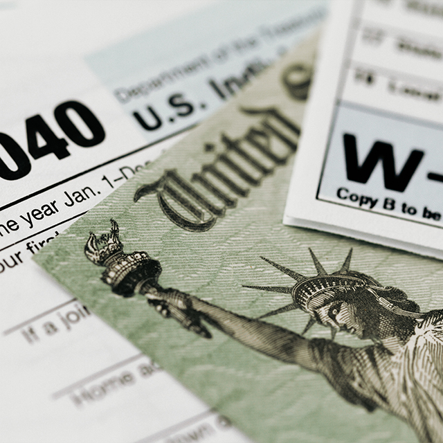 An array of tax documents collected on a table